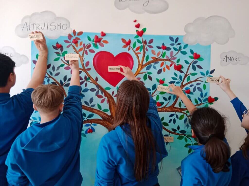 studenti che realizzano albero della gentilezza